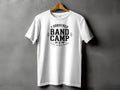 White t-shirt with "I survived band camp" and dates 20-26 text.