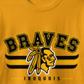 Braves Iroquois graphic with Native American profile and tribal patterns on gold shirt.