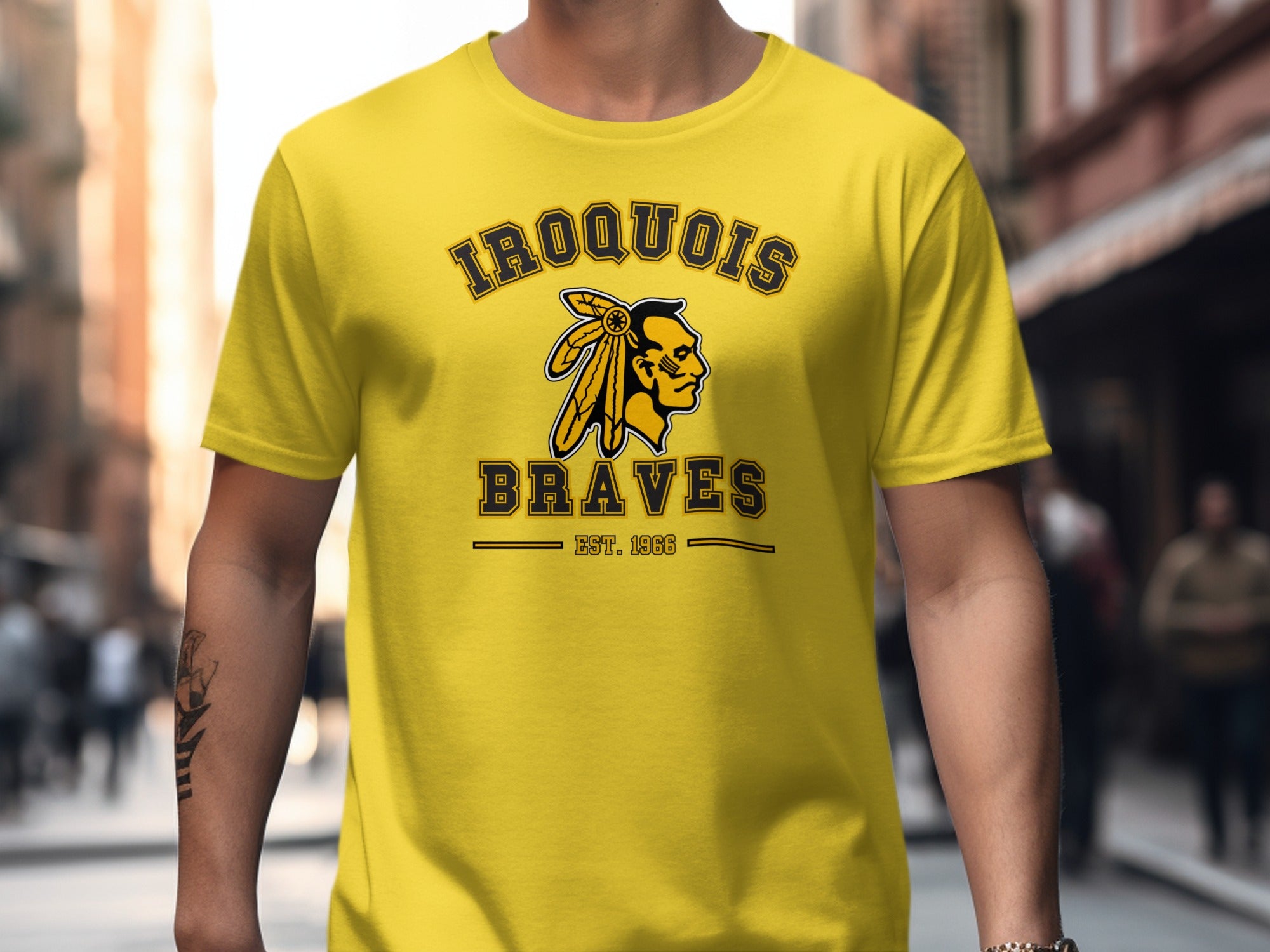 Yellow t-shirt with "Iroquois Braves Est. 1966" and Native American graphic.