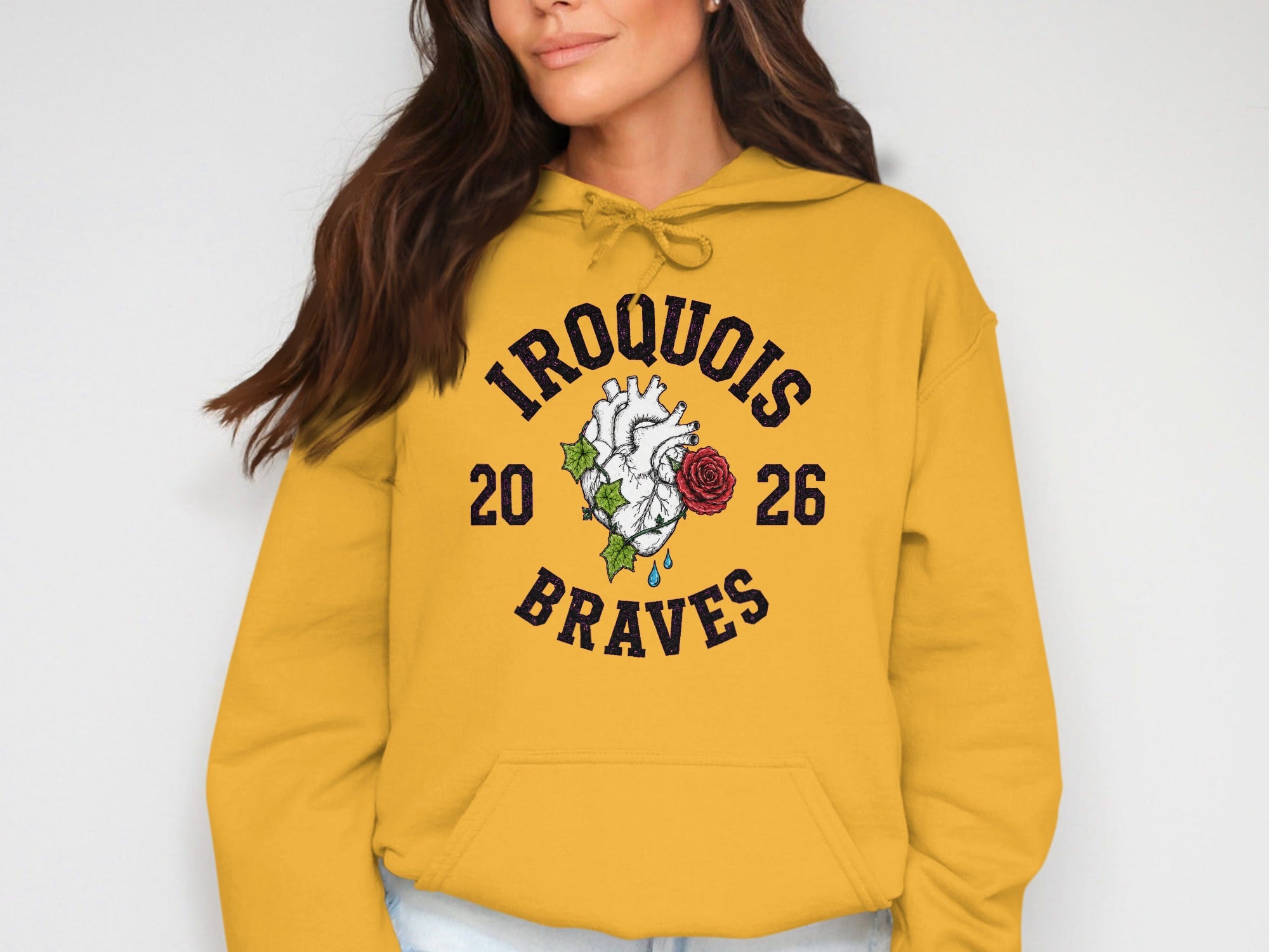 Yellow hoodie with "Iroquois 20 26 Braves" text and heart graphic.
