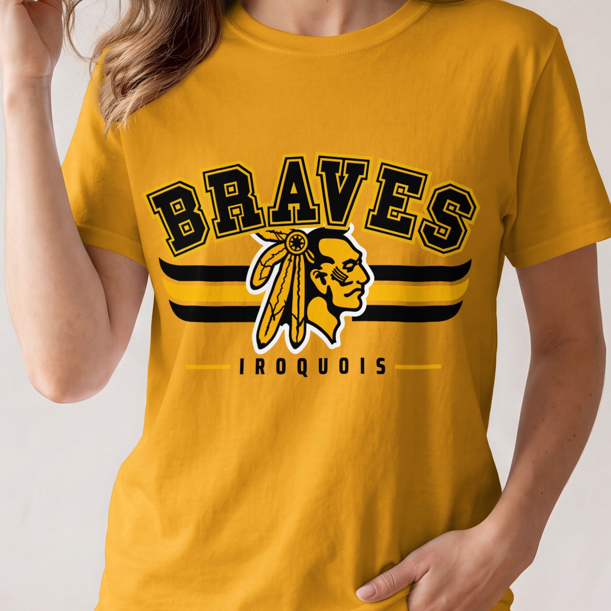 Yellow t-shirt with "Braves Iroquois" text and Native American profile logo.